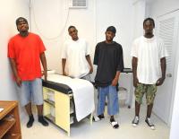 From left, Nathaniel Washington, Shaheem Miller, Orville Williams and Edmund Armstrong show pride in the examining room they built. From left, Nathaniel Washington, Shaheem Miller, Orville Williams and Edmund Armstrong show pride in the examining room they built.